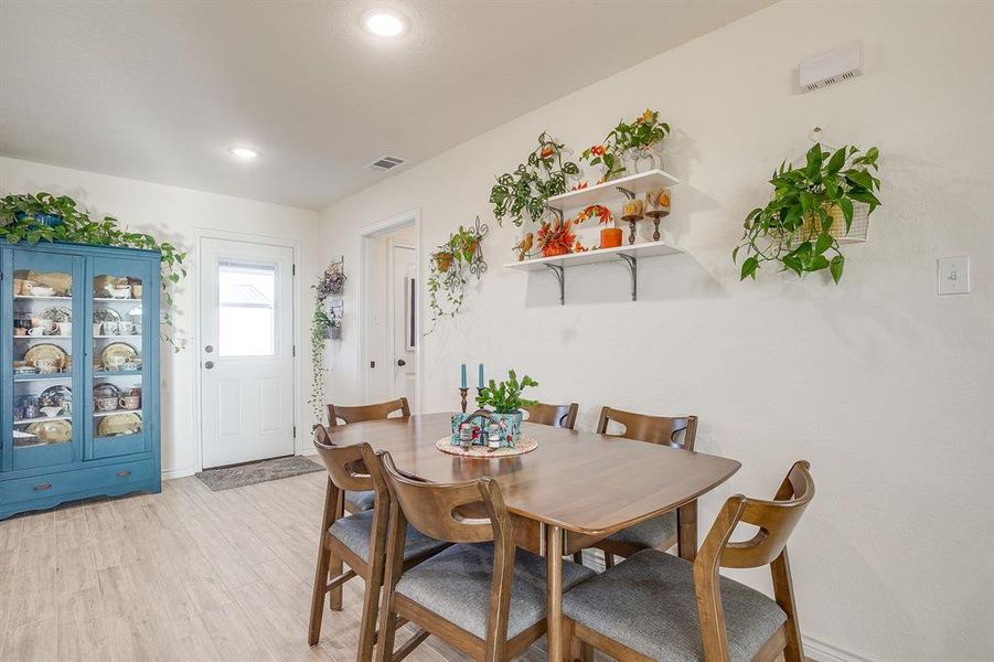 Dining space featuring light wood-style tile floors and recessed lighting Dining space featuring light wood-style tile floors and recessed lighting
