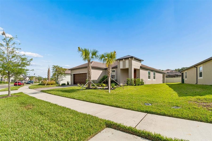 Front exterior of a new home in Mirada Active Adult, San Antonio, FL, highlighting curb appeal (Image 21).