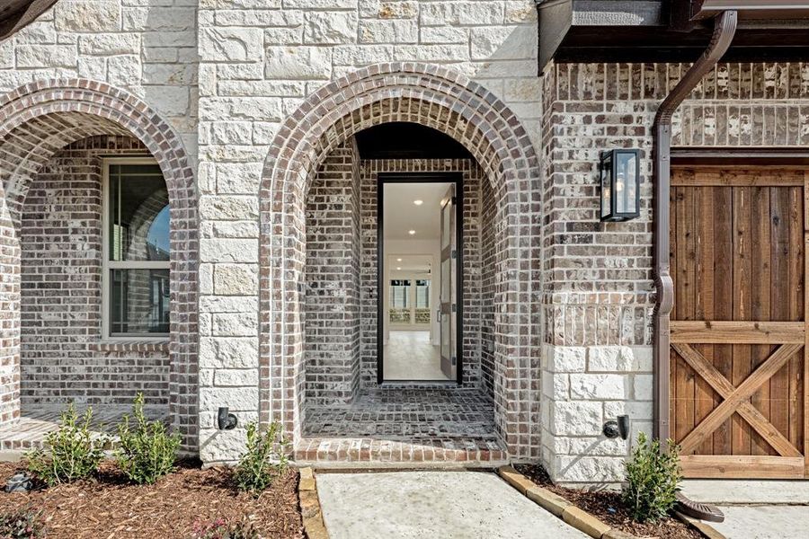 Front exterior of a new home in Painted Tree Woodland District 50, McKinney, TX, highlighting curb appeal (Image 24).