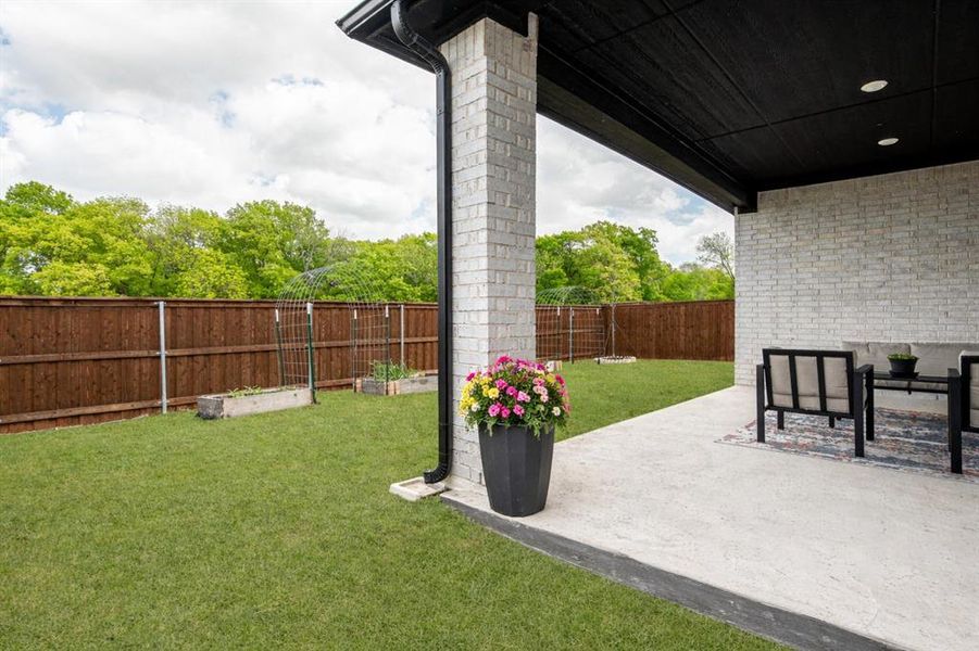Fenced backyard featuring a patio area