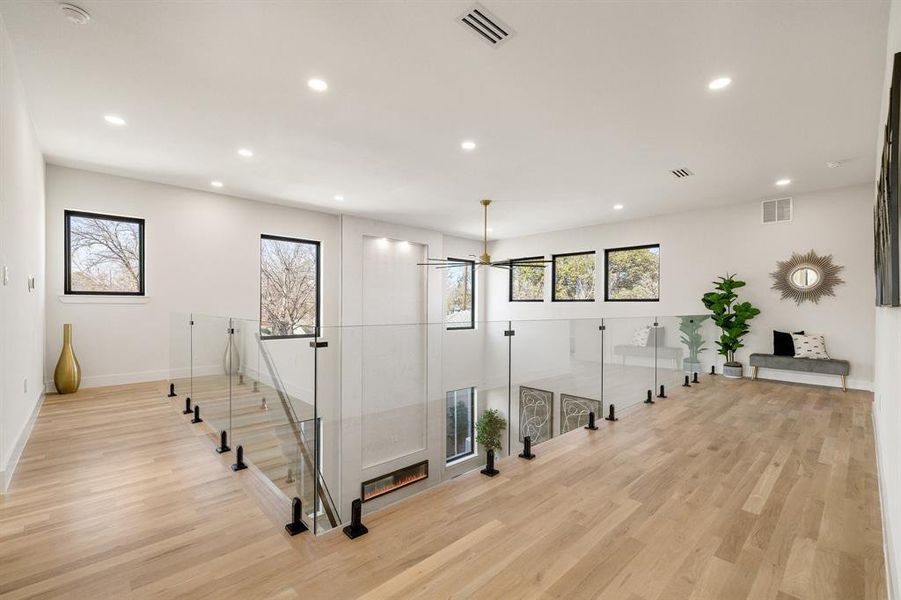 Corridor with light hardwood / wood-style floors