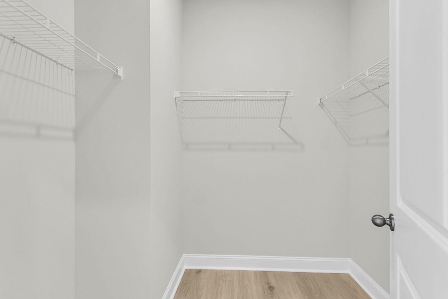 Spacious, unfurnished interior of a new home in Tidewater at Lakes of Cane Bay, Summerville (Image 60).