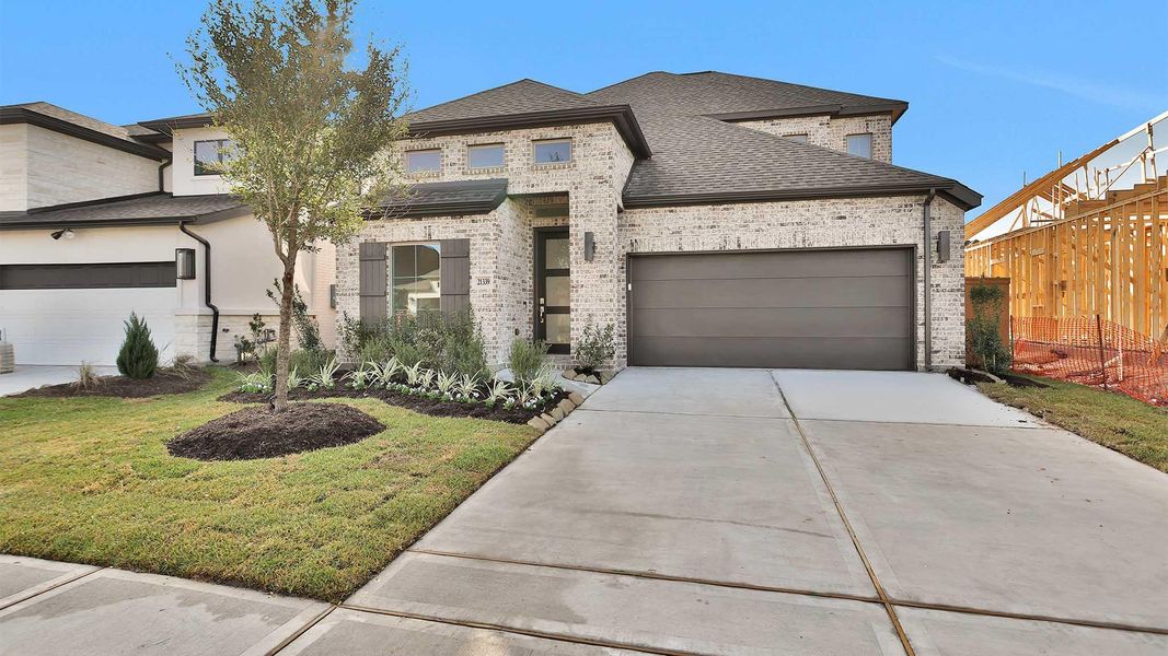 Front exterior of a new home in Marvida 45' - Gated, Cypress, TX, highlighting curb appeal (Image 1). Front exterior of a new home in Marvida 45' - Gated, Cypress, TX, highlighting curb appeal (Image 1).