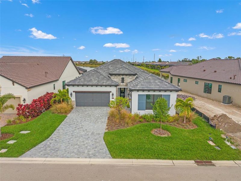 Front exterior of a new home in , Nokomis, FL, highlighting curb appeal (Image 1). Front exterior of a new home in , Nokomis, FL, highlighting curb appeal (Image 1).