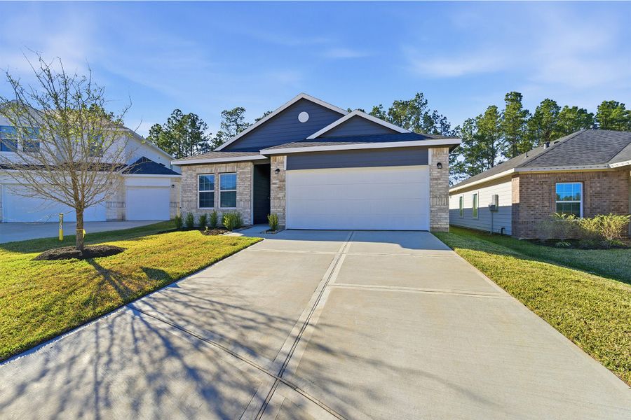 Front exterior of a new home in Magnolia Springs, Montgomery, TX, highlighting curb appeal (Image 2).