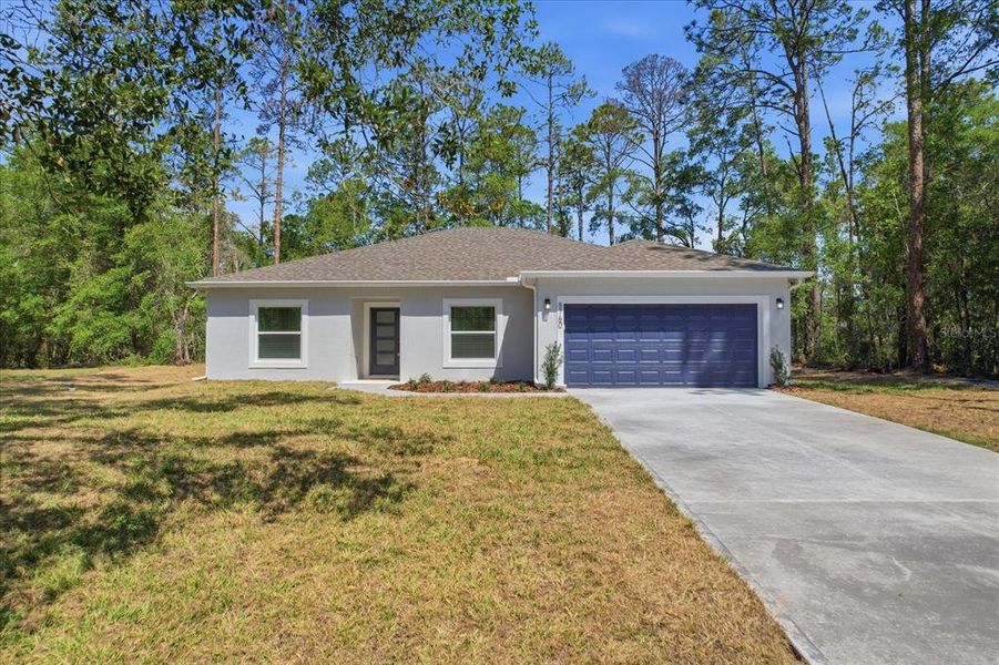 Front exterior of a new home in , Dunnellon, FL, highlighting curb appeal (Image 20).
