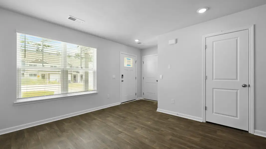 Spacious, unfurnished interior of a new home in Pine Hills Townhomes at Cane Bay, Summerville (Image 11). Spacious, unfurnished interior of a new home in Pine Hills Townhomes at Cane Bay, Summerville (Image 11).