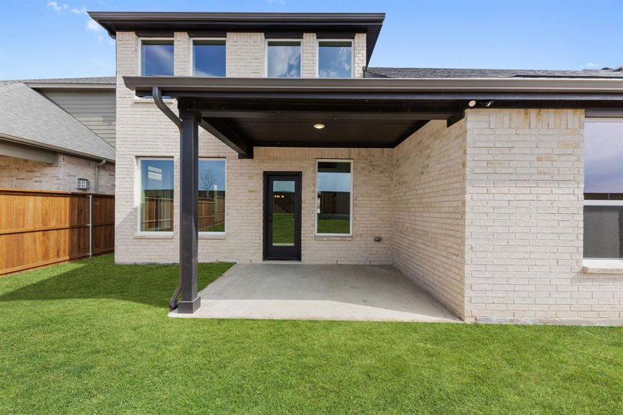Dining al fresco is in your future on this lovely covered back patio.
