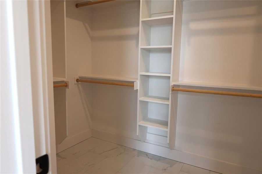 Spacious closet with tile patterned floors