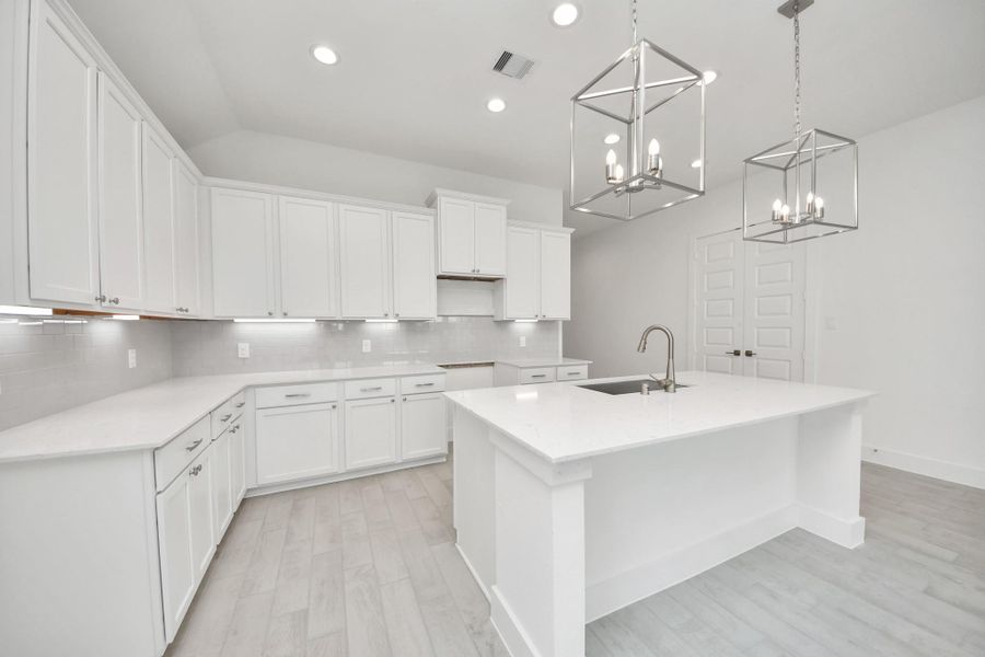 This kitchen is by far any chef’s dream! This spacious kitchen features high ceilings, light stained wood cabinets, granite countertop, SS appliances, modern tile backsplash, recessed lighting, extended counter space, granite kitchen island, and space for breakfast bar, and a walk-in pantry all overlooking your huge family room. This kitchen is by far any chef’s dream! This spacious kitchen features high ceilings, light stained wood cabinets, granite countertop, SS appliances, modern tile backsplash, recessed lighting, extended counter space, granite kitchen island, and space for breakfast bar, and a walk-in pantry all overlooking your huge family room.