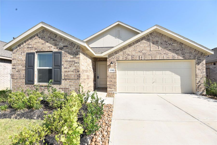 Front exterior of a new home in , New Caney, TX, highlighting curb appeal (Image 2). Front exterior of a new home in , New Caney, TX, highlighting curb appeal (Image 2).