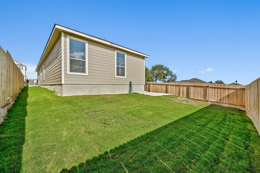 Exterior details and patio area of a home in Creekside at Estancia, Austin (Image 4).