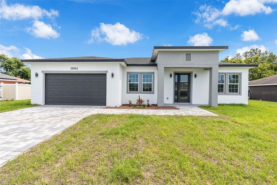 Front exterior of a new home in , Ocala, FL, highlighting curb appeal (Image 21).
