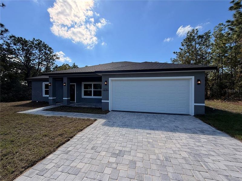 Front exterior of a new home in , Dunnellon, FL, highlighting curb appeal (Image 2). Front exterior of a new home in , Dunnellon, FL, highlighting curb appeal (Image 2).