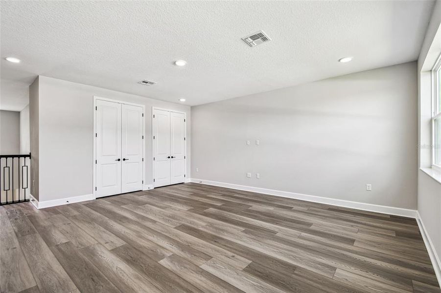 Spacious, unfurnished interior of a new home in Solace at Corner Lake, Orlando (Image 42).