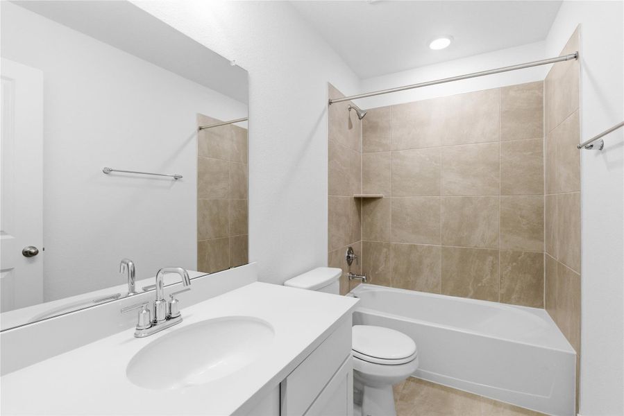 Bathroom featuring washtub / shower combination and vanity