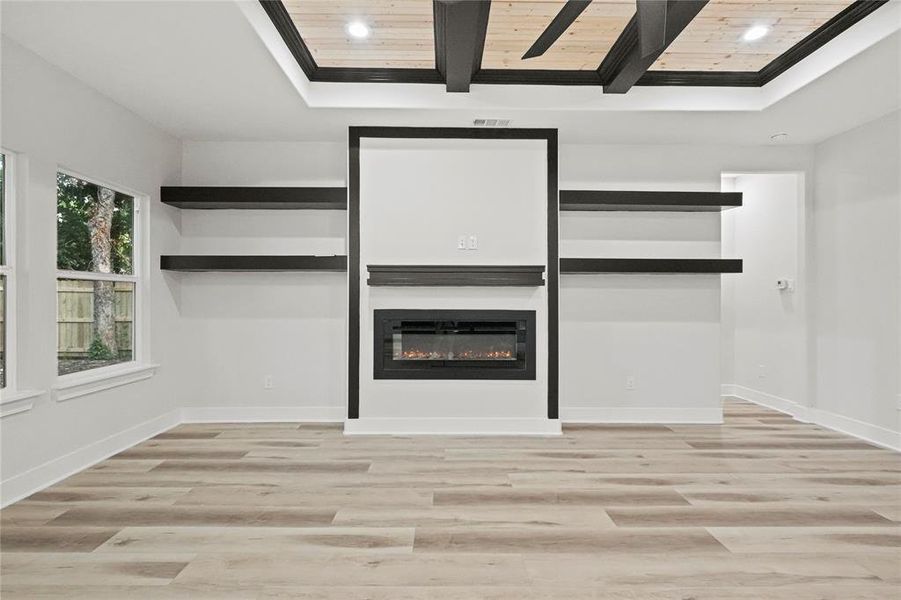 Unfurnished living room featuring wood ceiling and light wood-type flooring