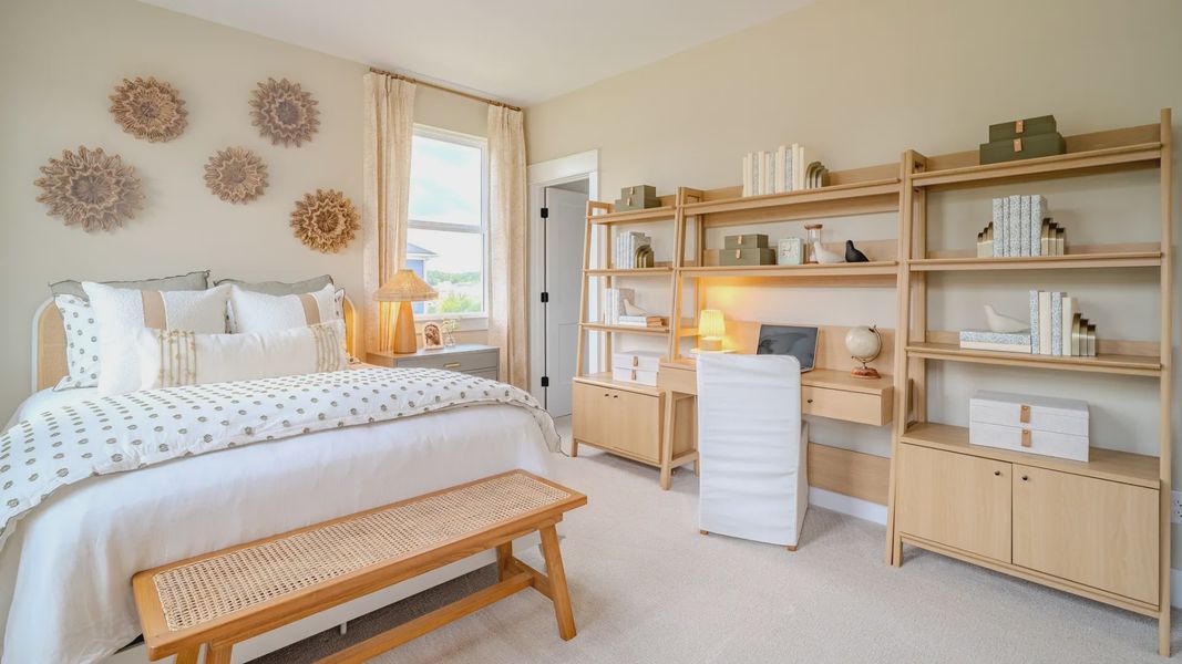Secondary bedroom with carpet and bright natural light from windows Secondary bedroom with carpet and bright natural light from windows