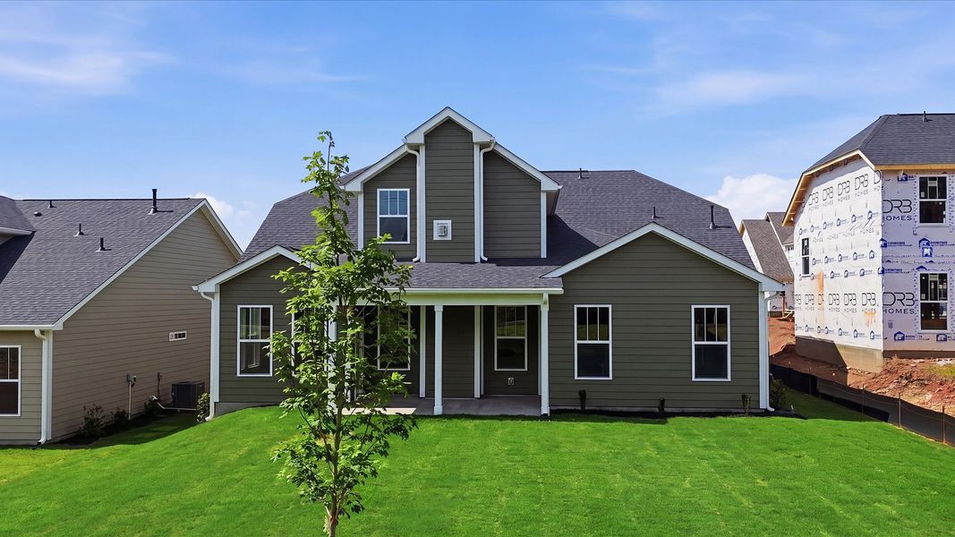 Warm and inviting outdoor living space with a covered rear porch and tasteful finishes located in Woodruff, SC Warm and inviting outdoor living space with a covered rear porch and tasteful finishes located in Woodruff, SC