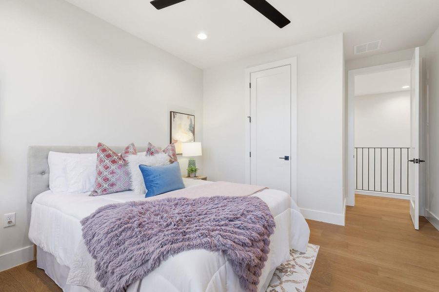 Bedroom featuring recessed lighting, light wood finished floors, and a ceiling fan