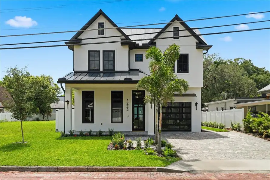 Front exterior of a new home in , Orlando, FL, highlighting curb appeal (Image 1). Front exterior of a new home in , Orlando, FL, highlighting curb appeal (Image 1).