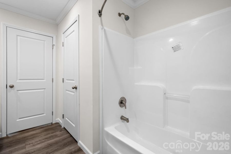 Hall bath with tub/shower combination and linen closet