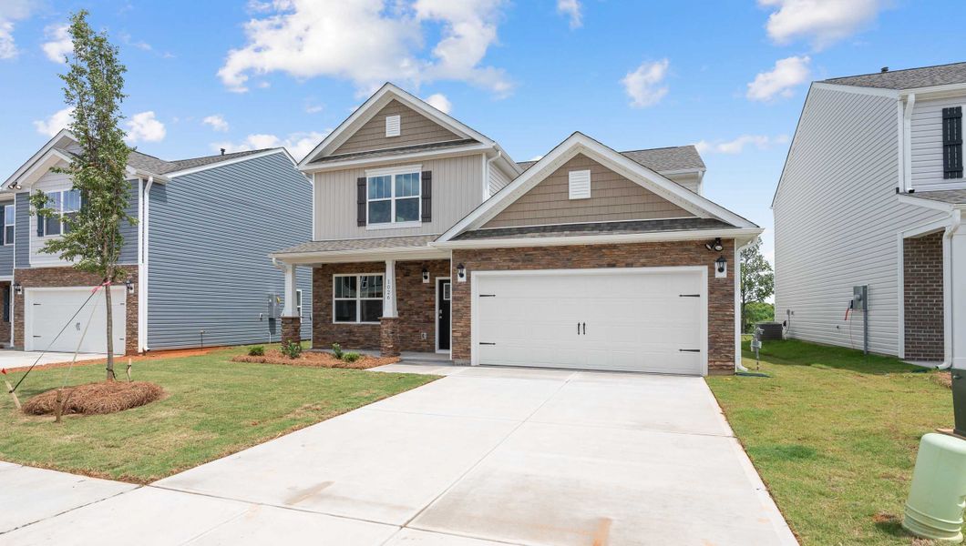 Front exterior of a new home in Hunters Ridge, Woodruff, SC, highlighting curb appeal (Image 21).