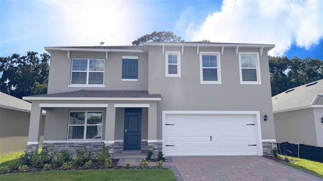 Front exterior of a new home in Sagewood, Apopka, FL, highlighting curb appeal (Image 1). Front exterior of a new home in Sagewood, Apopka, FL, highlighting curb appeal (Image 1).