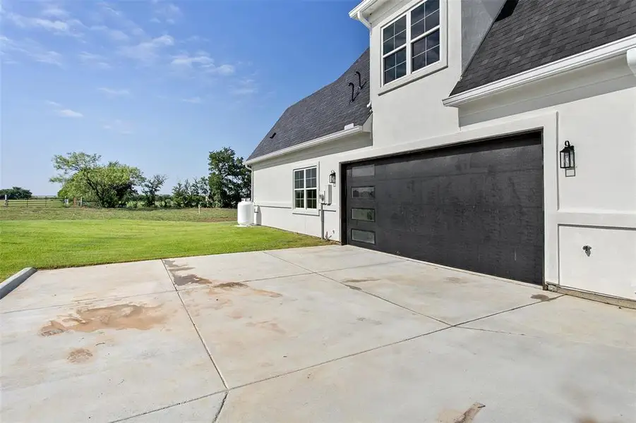 Exterior details and patio area of a home in , Joshua (Image 4).