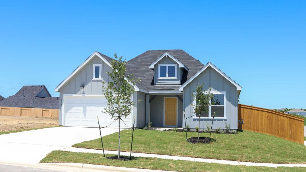 Front exterior of a new home in Trace, San Marcos, TX, highlighting curb appeal (Image 2). Front exterior of a new home in Trace, San Marcos, TX, highlighting curb appeal (Image 2).