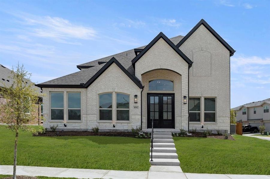 Front exterior of a new home in Trails at Cottonwood Creek, Rowlett, TX, highlighting curb appeal (Image 19).