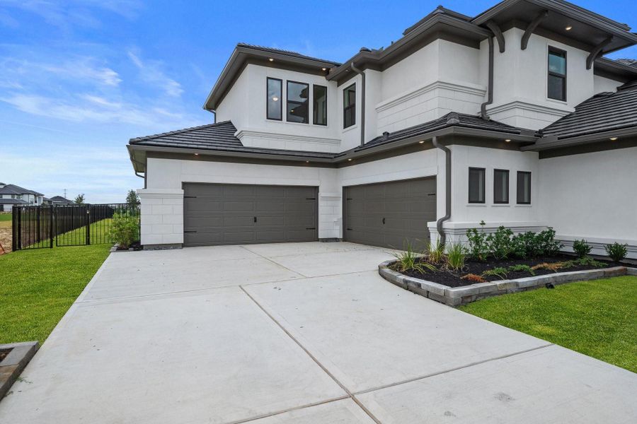 Expansive 4-car garage, perfect for car collectors, outdoor gear, or multi-vehicle families. Expansive 4-car garage, perfect for car collectors, outdoor gear, or multi-vehicle families.