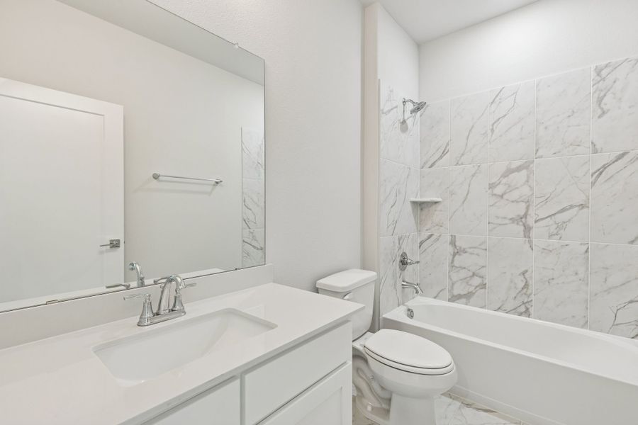 Bathroom in the Stanley II home plan by Trophy Signature Homes – REPRESENTATIVE PHOTO