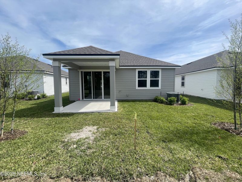 Exterior details and patio area of a home in Palm Series at Seminole Palms, Palm Coast (Image 24).