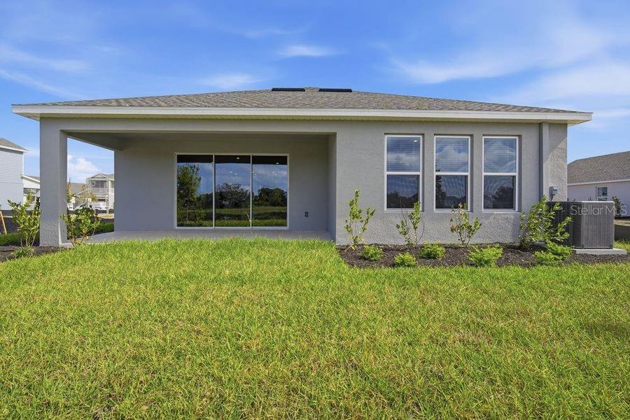 Exterior details and patio area of a home in Indigo Creek, Apollo Beach (Image 4).