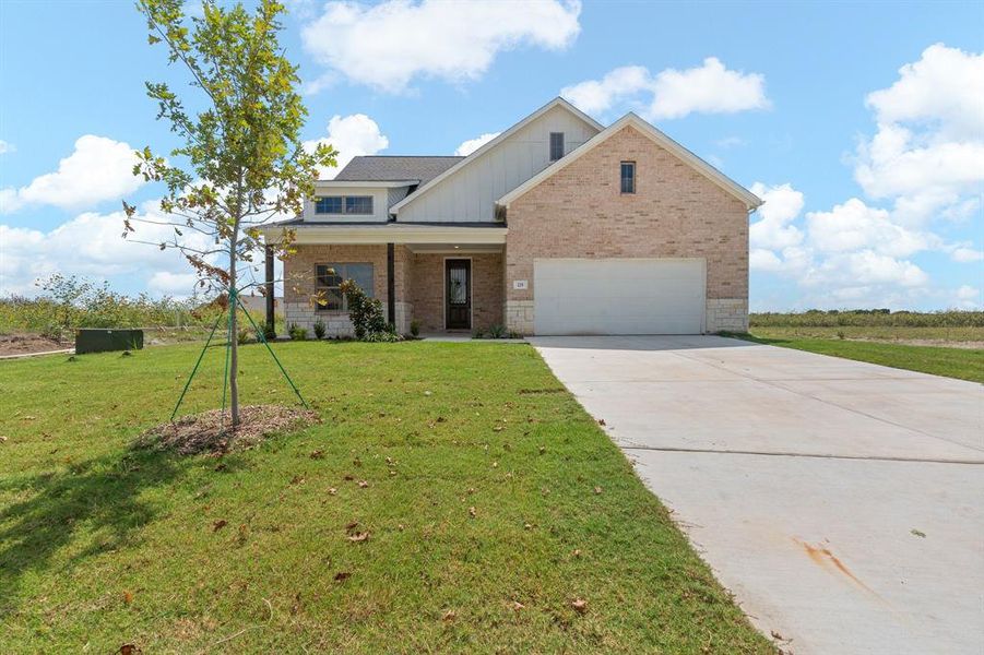 Front exterior of a new home in , Venus, TX, highlighting curb appeal (Image 1).