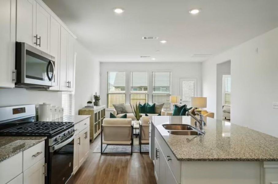 Photo of Pulte model home with same floor plan, not of actual home listed.