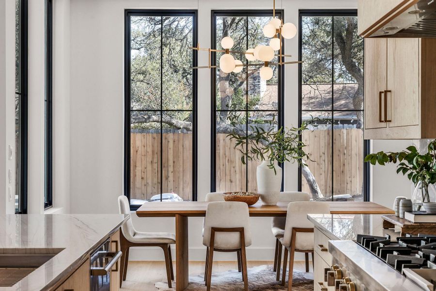 Dining room with healthy amount of natural light and a chandelier