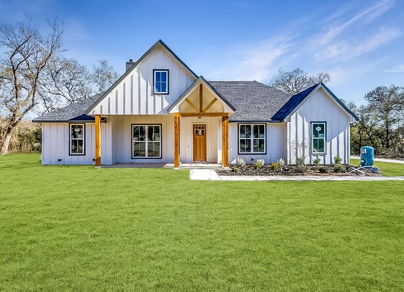 Representative exterior photo of a completed home built from the Abrams by Trinity Classic Homes in Freeman Ranch, Weatherford, TX (Image 1).