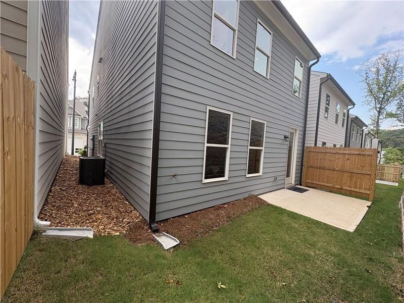 Exterior details and patio area of a home in The Village at Shallowford, Kennesaw (Image 2). Exterior details and patio area of a home in The Village at Shallowford, Kennesaw (Image 2).