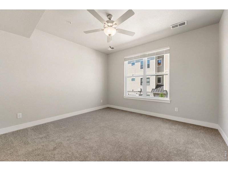 Spacious, unfurnished interior of a new home in The Lakes at Centerra - North Shore Flats, Loveland (Image 12).