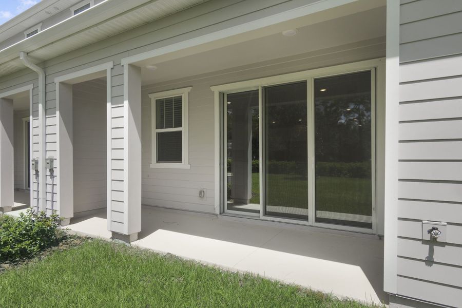 Exterior details and patio area of a home in Towns at Riverwalk, Sanford (Image 2). Exterior details and patio area of a home in Towns at Riverwalk, Sanford (Image 2).