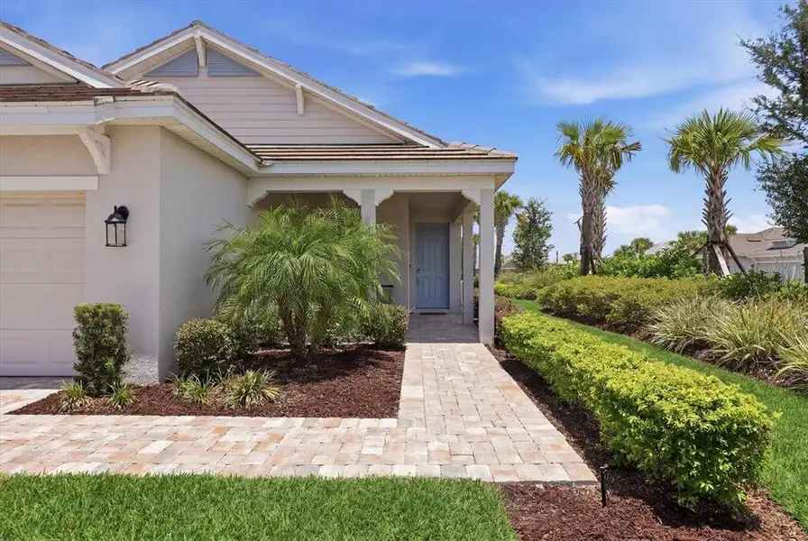 Front exterior of a new home in , Palmetto, FL, highlighting curb appeal (Image 20). Front exterior of a new home in , Palmetto, FL, highlighting curb appeal (Image 20).