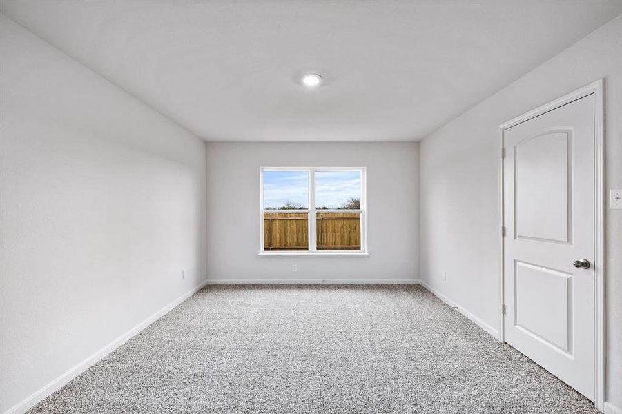 Unfurnished room featuring carpet flooring