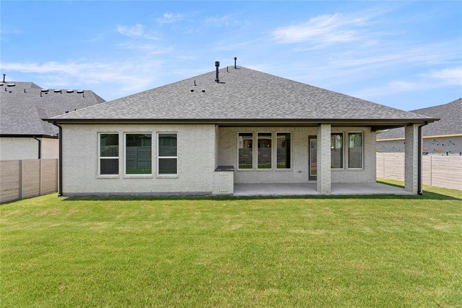Front exterior of a new home in Painted Tree Woodlands, McKinney, TX, highlighting curb appeal (Image 2).