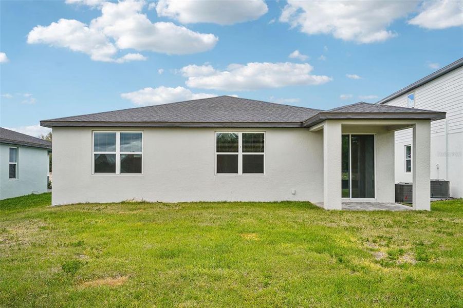 Exterior details and patio area of a home in The Reserve at Hammock Oaks - Signature Series, Lady Lake (Image 23).
