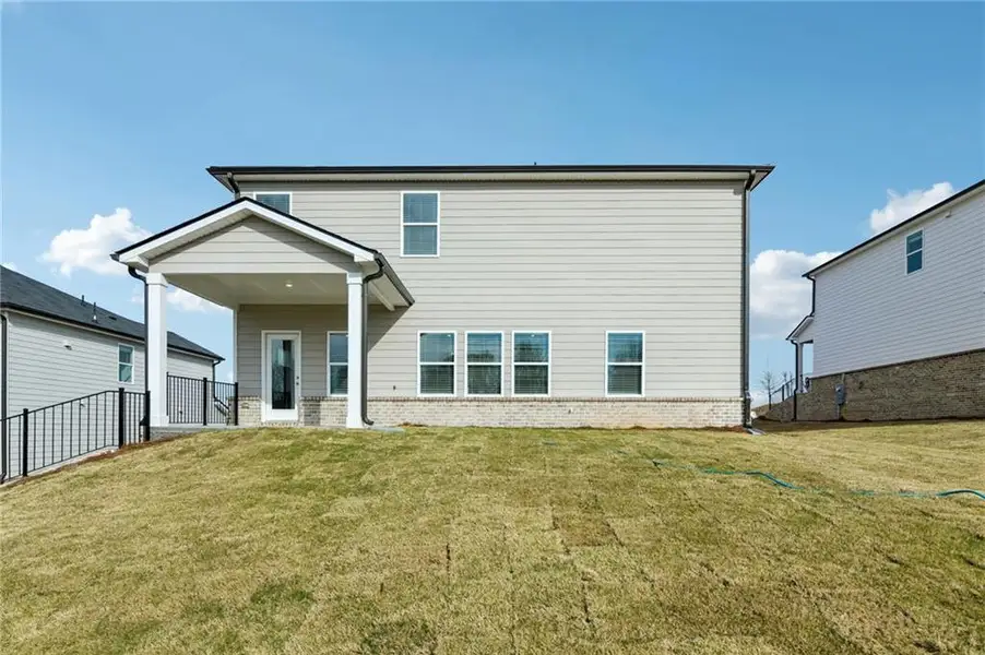 Exterior details and patio area of a home in Preserve at Mountain Creek, Pendergrass (Image 3).