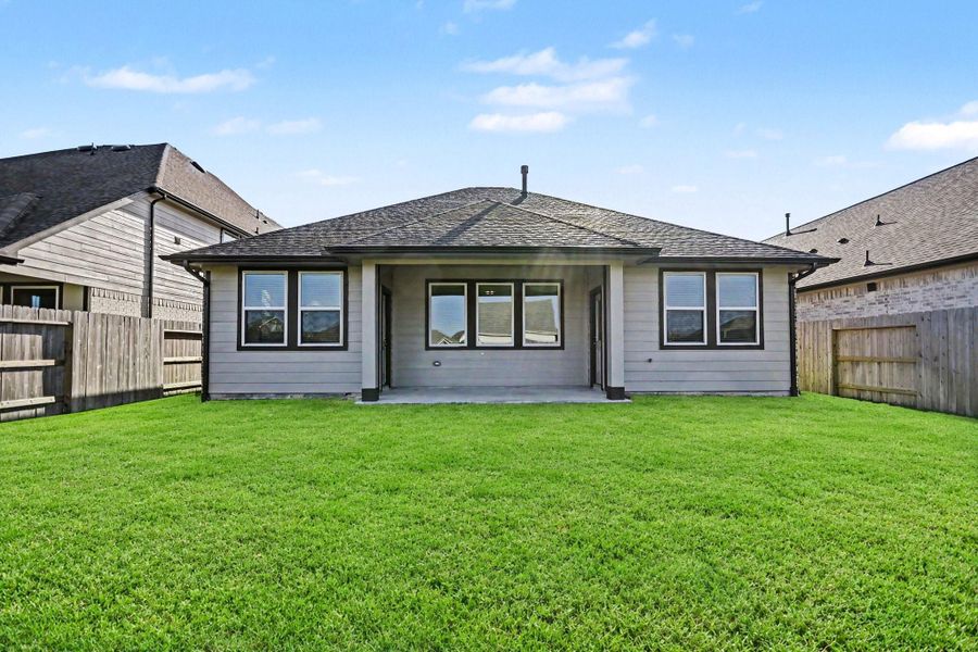Spacious backyard and covered patio perfect for outdoor entertaining and relaxation.
