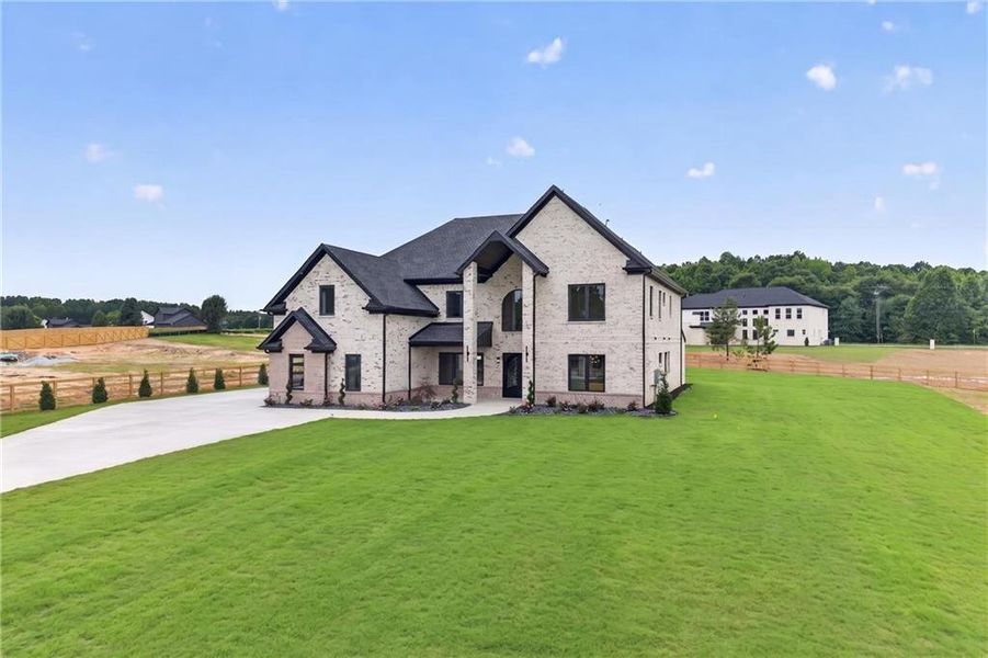 Front exterior of a new home in , Dacula, GA, highlighting curb appeal (Image 27). Front exterior of a new home in , Dacula, GA, highlighting curb appeal (Image 27).