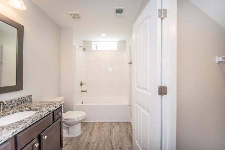 Representative furnished interior of a home built from the Quincy by Enchanted Homes in Hampshire Heights, Moore (Image 7).